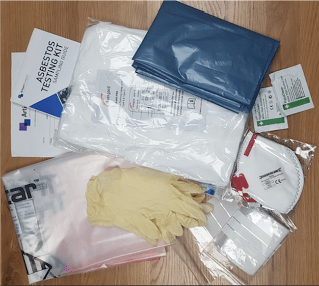 Image of what is inside an asbestos testing kit. This kit can be used to inspect a flat roof and any other adjacent material that could contain asbestos. It contains PPE items such as gloves, a face mask, sample bags, hygienic wipes for cleaning, instructions on how to use, waste bags to dispose of asbestos and a form to fill in.